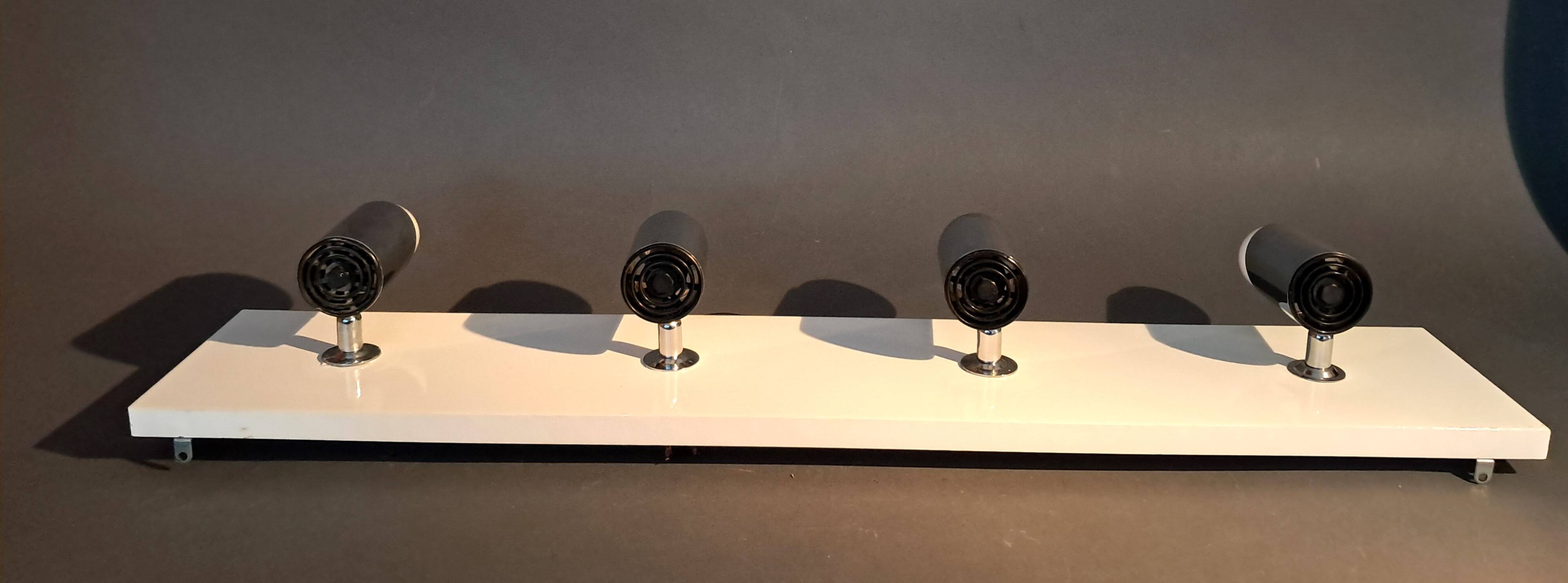 Targetti Sankey spotlights on white lacquered wooden ramp