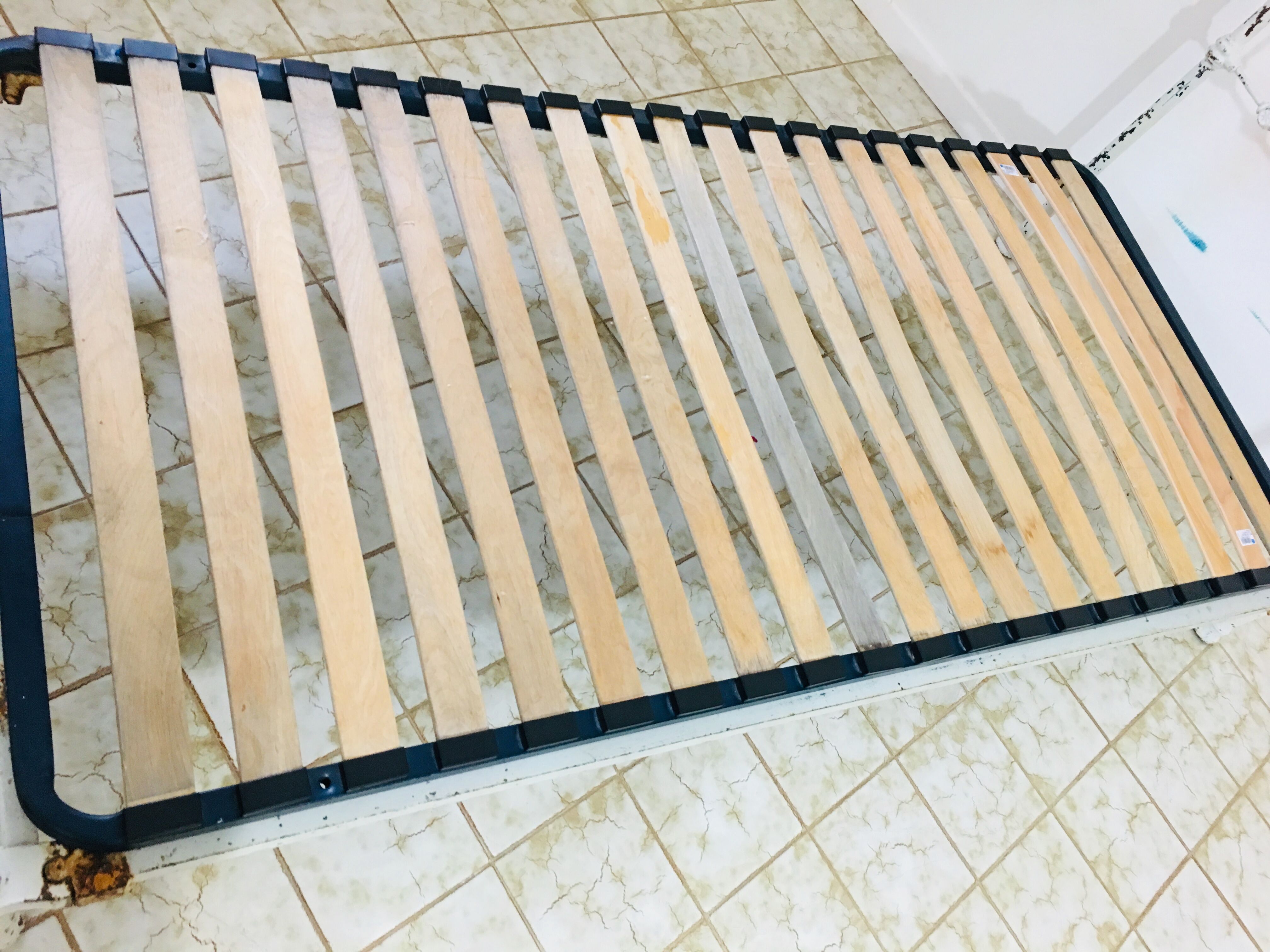 Old white metal and brass bed