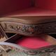 Antique corner cabinet in Louis XV style, topped with a marble surface.