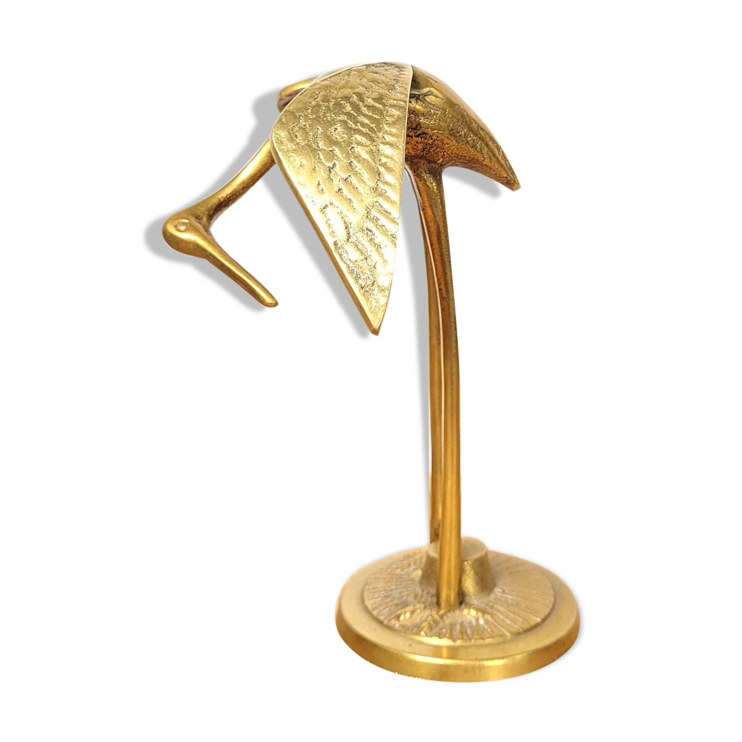 Brass heron head down