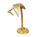 Brass heron head down
