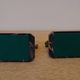Art Deco pair of bookends with stylised fish in patinated metal and marble.