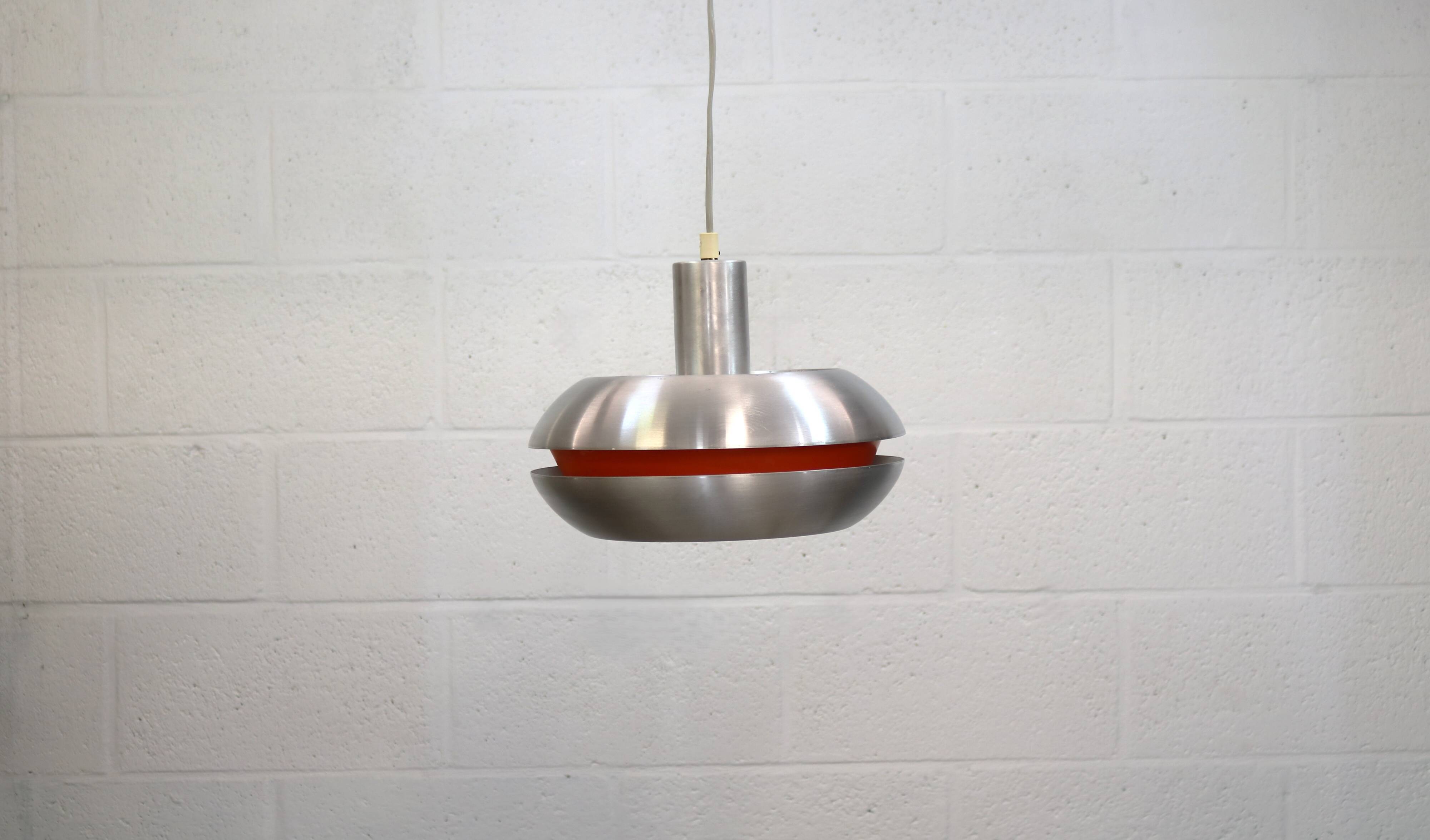 Old Danish space age design lamp in alu and orange inside.