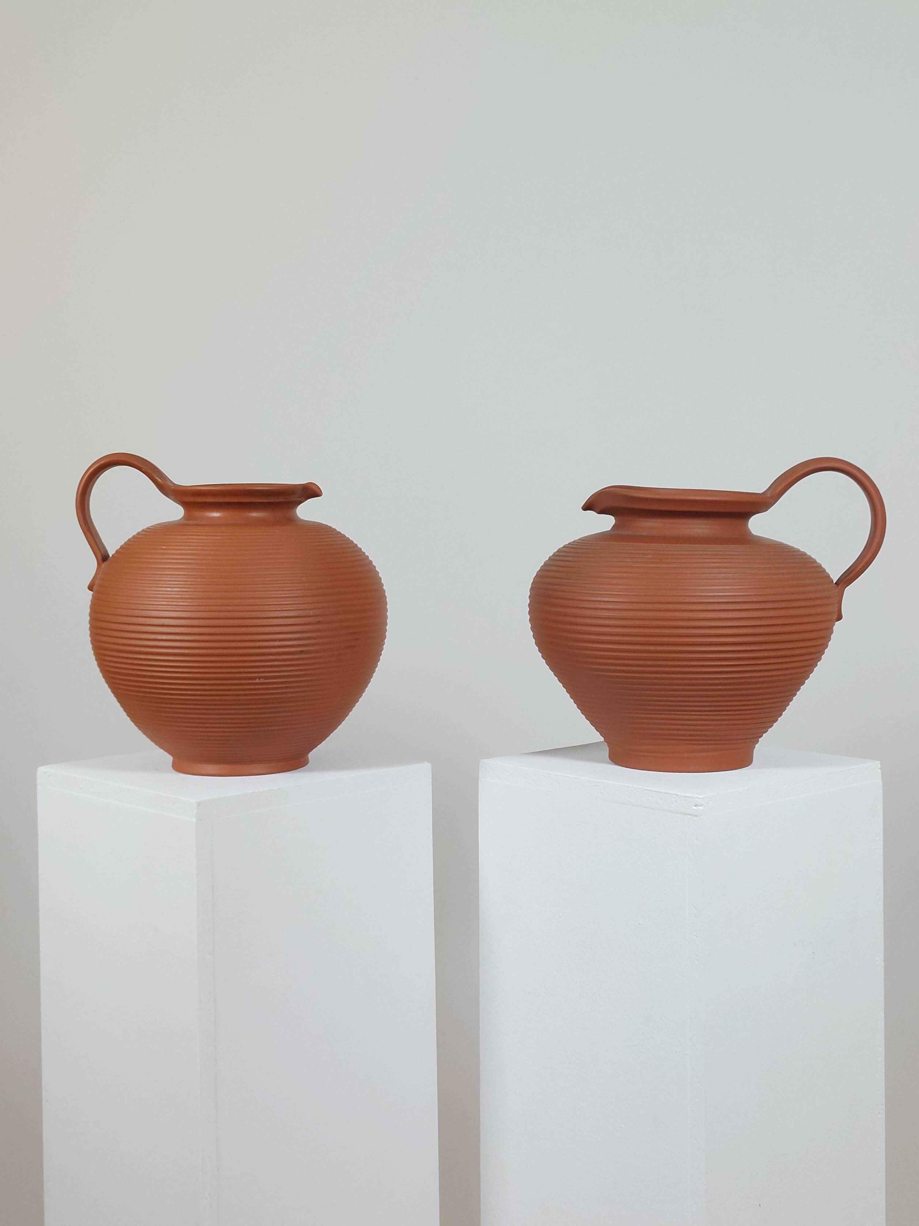 Pair of handcrafted terracotta vases from the mid-century.