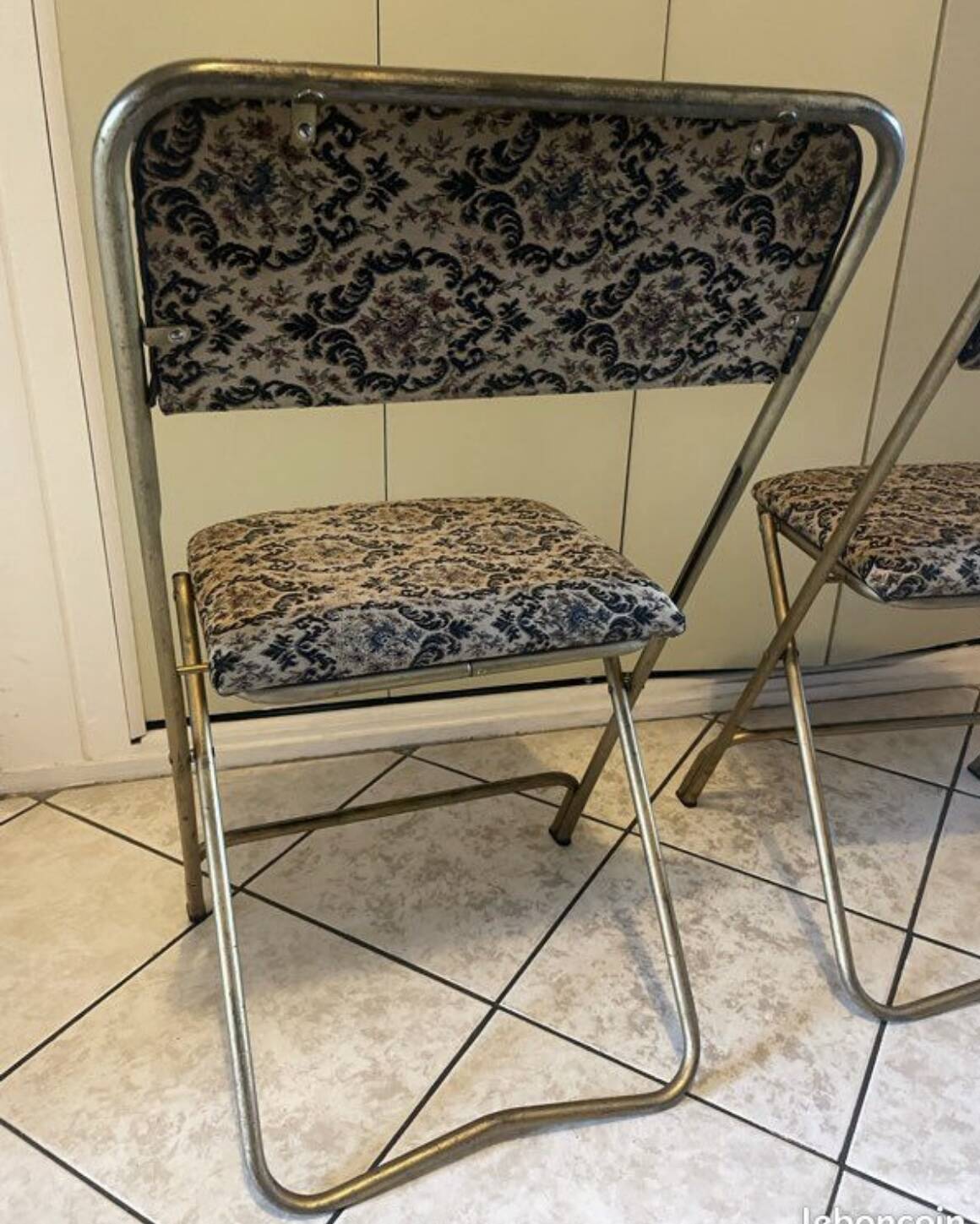 Two antique Manufrance folding chairs in metal and fabric