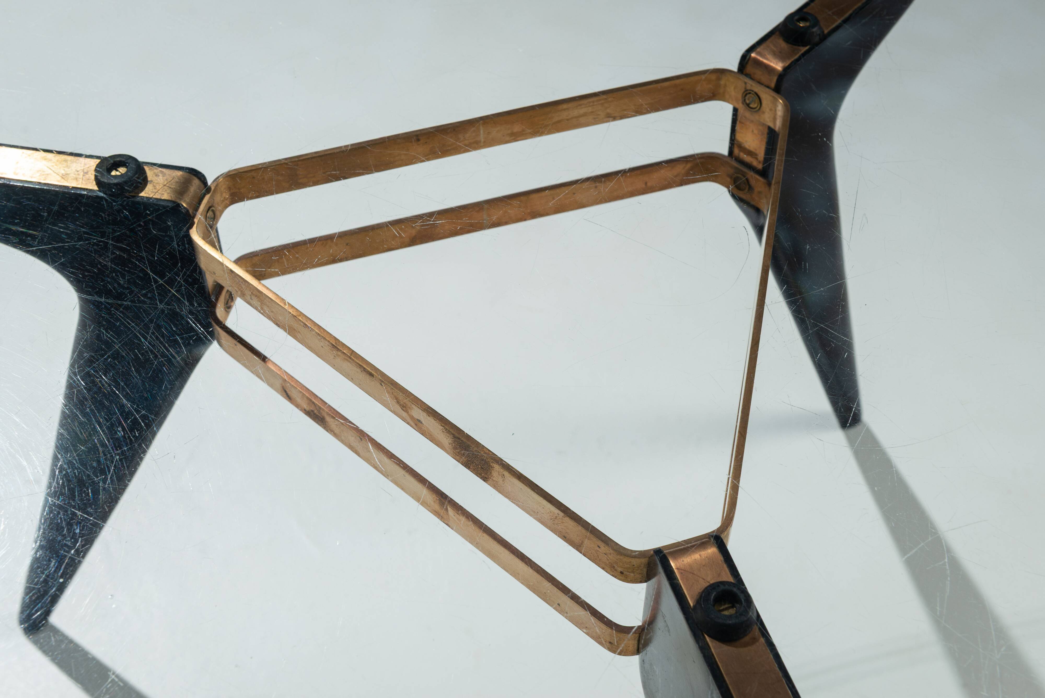 Triangular coffee table in the manner of Alfred Hendrickx