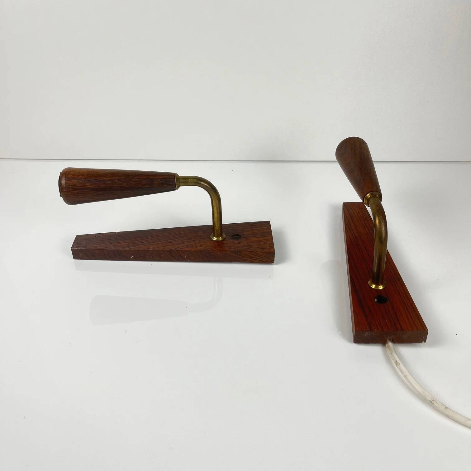 Pair of Danish wall lights in rosewood, 1960s/70s.