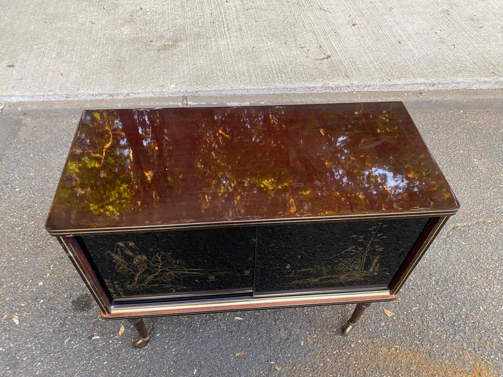 Illuminated bar cabinet Hollywood Regency black and gold 1970