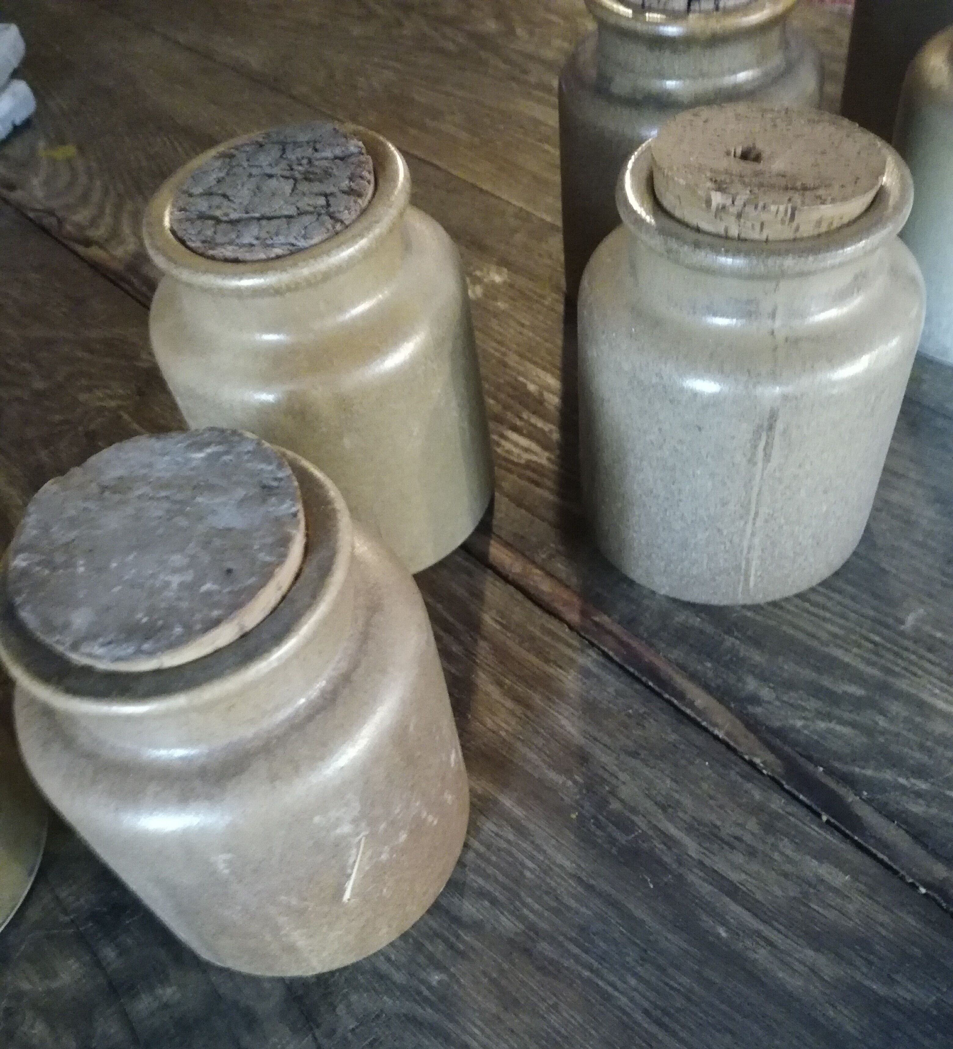 Lot of seven sandstone spice pots