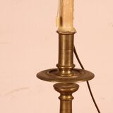 bronze candlestick from the 17th century converted into a lamp with its lampshade