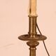 bronze candlestick from the 17th century converted into a lamp with its lampshade