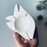 Travertine fish pocket emptier