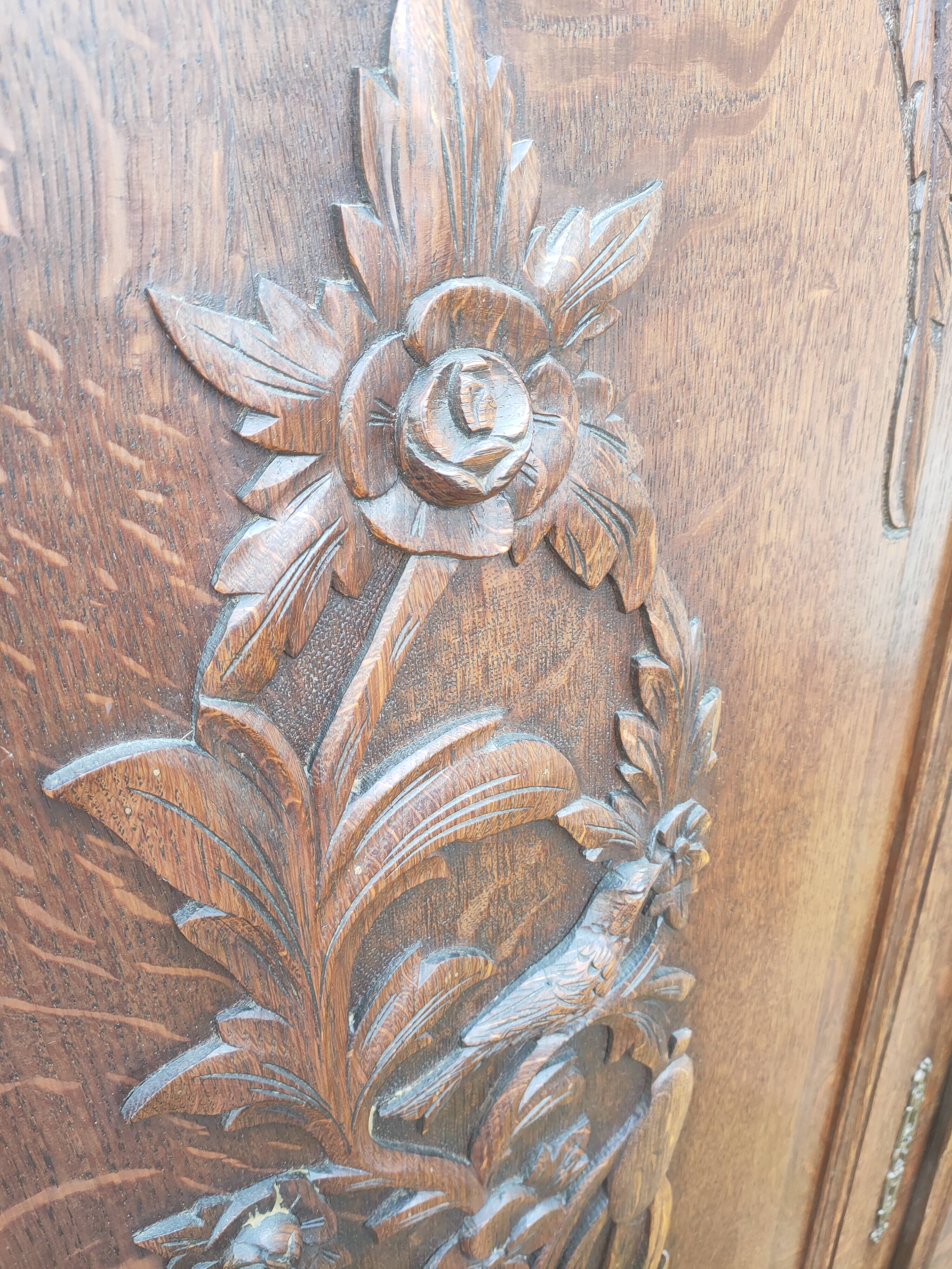 pair of antique solid oak cabinet doors with bird decor