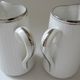Pair of creamers in white porcelain enhanced with platinum