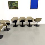 Series of six swivel chairs with an organic shell, patterned fabric and base.