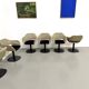 Series of six swivel chairs with an organic shell, patterned fabric and base.