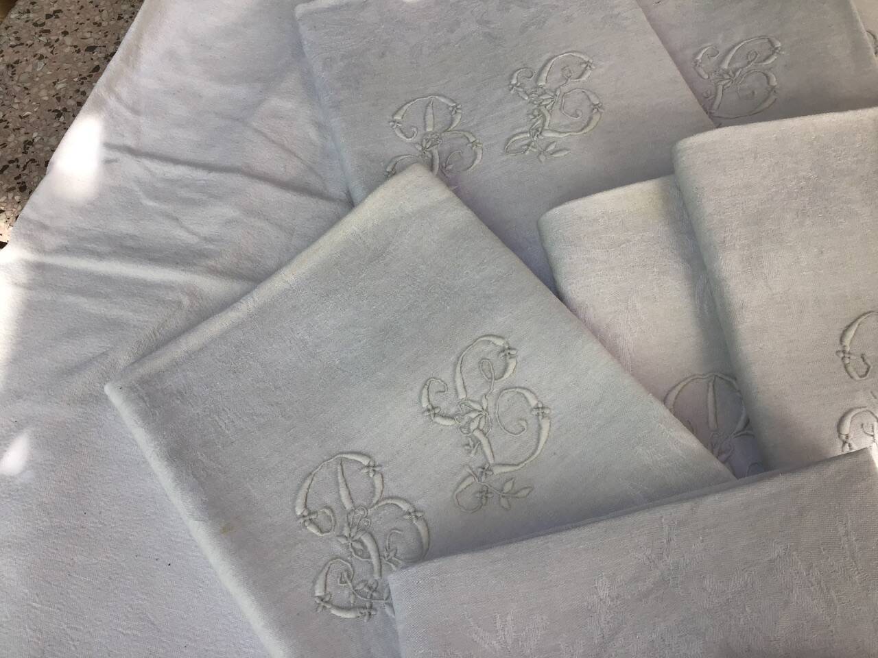 Set of 12 19th century white napkins marked “BL”