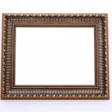 Unique mirror in a gold frame.