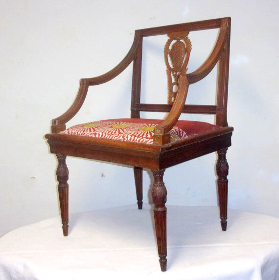 A Chair from the beginning of the 20th century in natural wood.