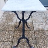 White marble table, cast iron base signed SNES, made in France