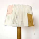 Wooden candle holder mounted as a lamp and its rope shade, 47.5cm.