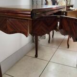 Console transforming into a 19th century Louis XV style gaming table