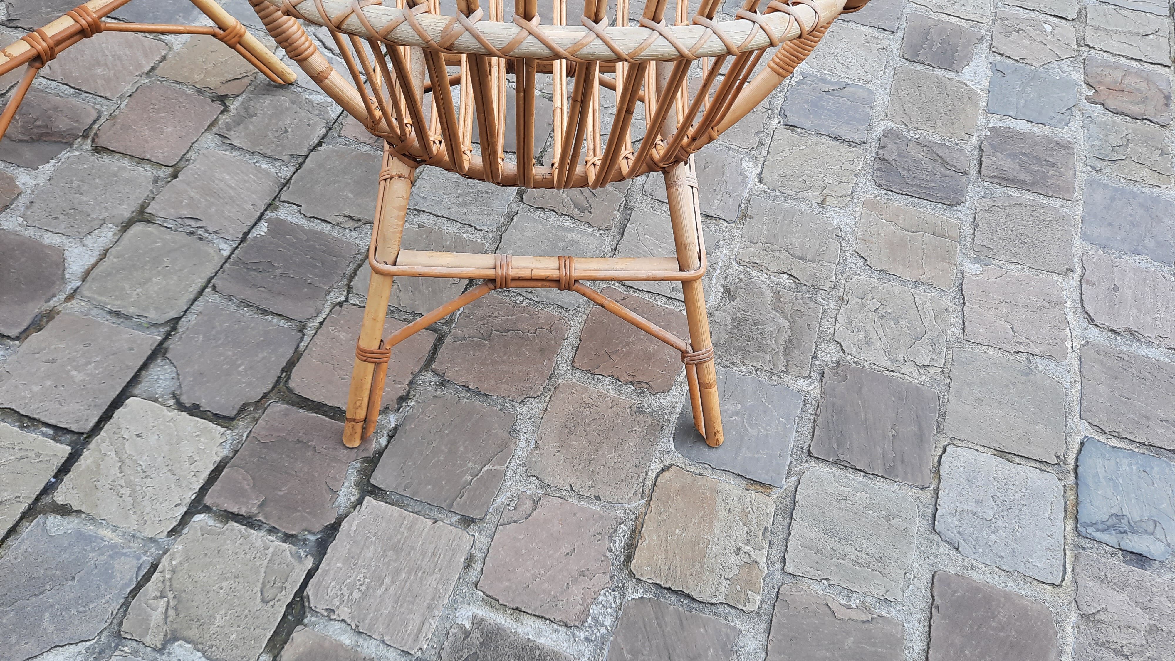 Pairs of shell rattan armchairs from the 50