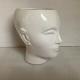 Man's head hide pot vase