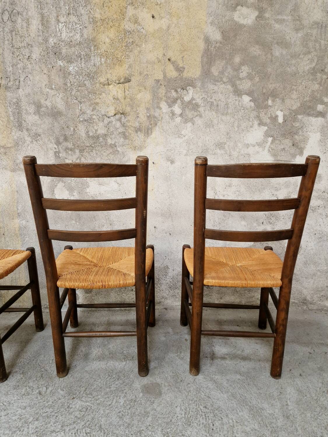 4 wooden and straw chairs