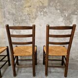 4 wooden and straw chairs