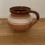 Hungarian folk ceramic pitcher in glossy brown and beige, traditional rounded pot.