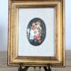 Vintage floral print with oval mat and gold wooden frame.