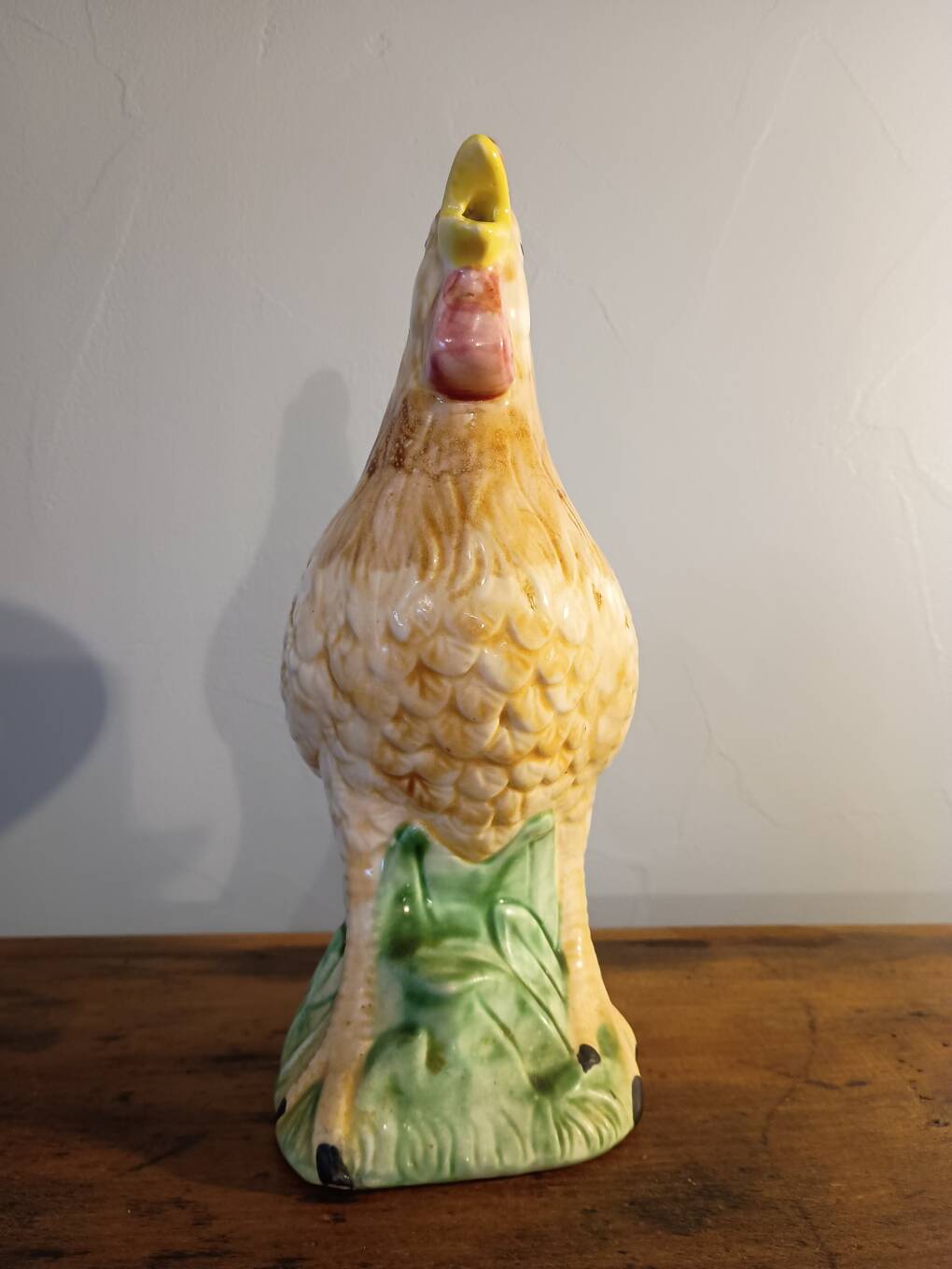 Vintage slipware jug in the shape of a rooster.