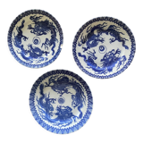 Asian porcelain plates decorated with blue dragons