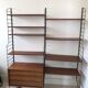 Self-supporting modular wall shelf