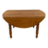 Table ronde à rabats en châtaignier