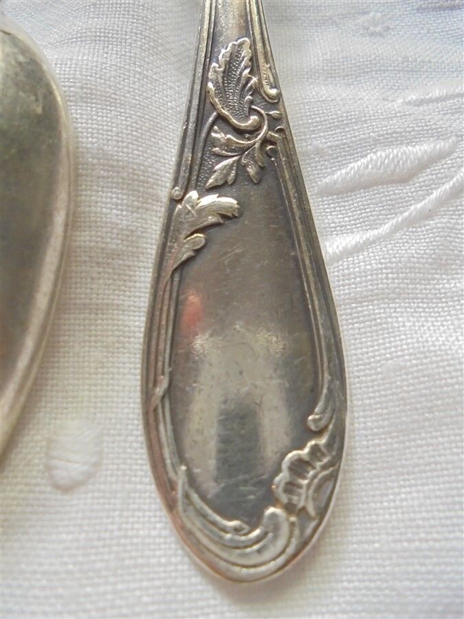 8 teaspoons made of silver metal