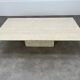 Rectangular travertine coffee table with central leg