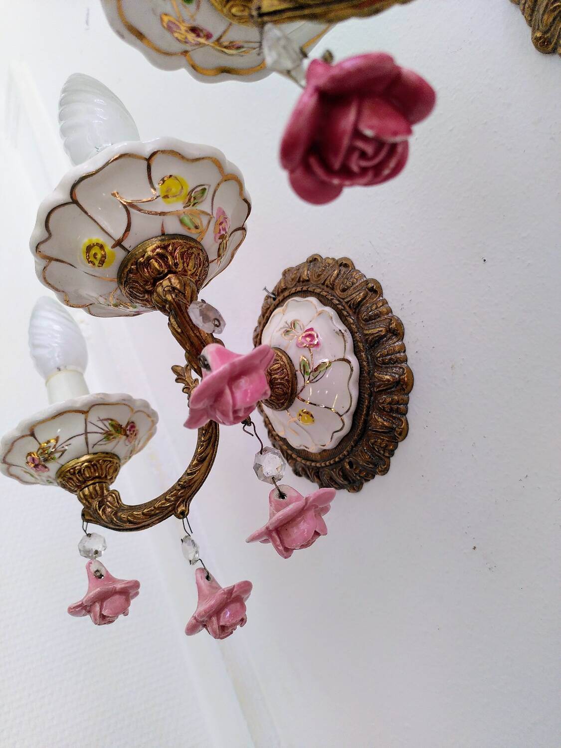 Pair of brass and porcelain wall lights