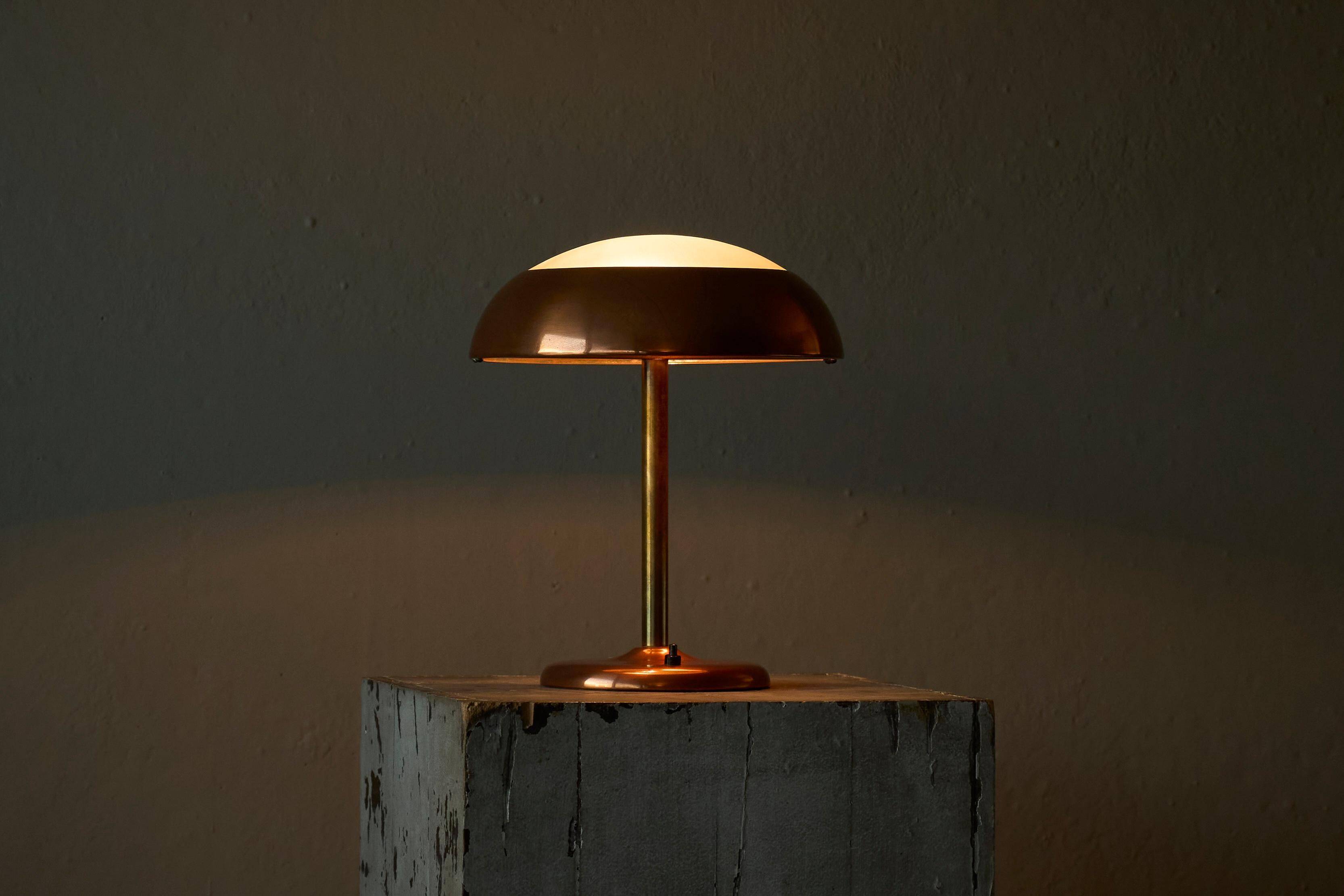 Art Deco table lamp in patinated copper, brass, and satin glass from the 1950s.