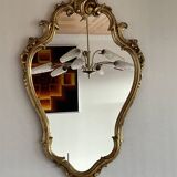 Old baroque style wall mirror with golden moldings