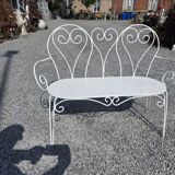 Old garden bench in solid wrought iron