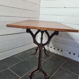 Bistro table with cast iron base and oak top