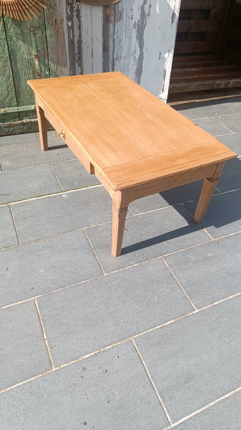 Solid wood coffee table with drawer and original key.