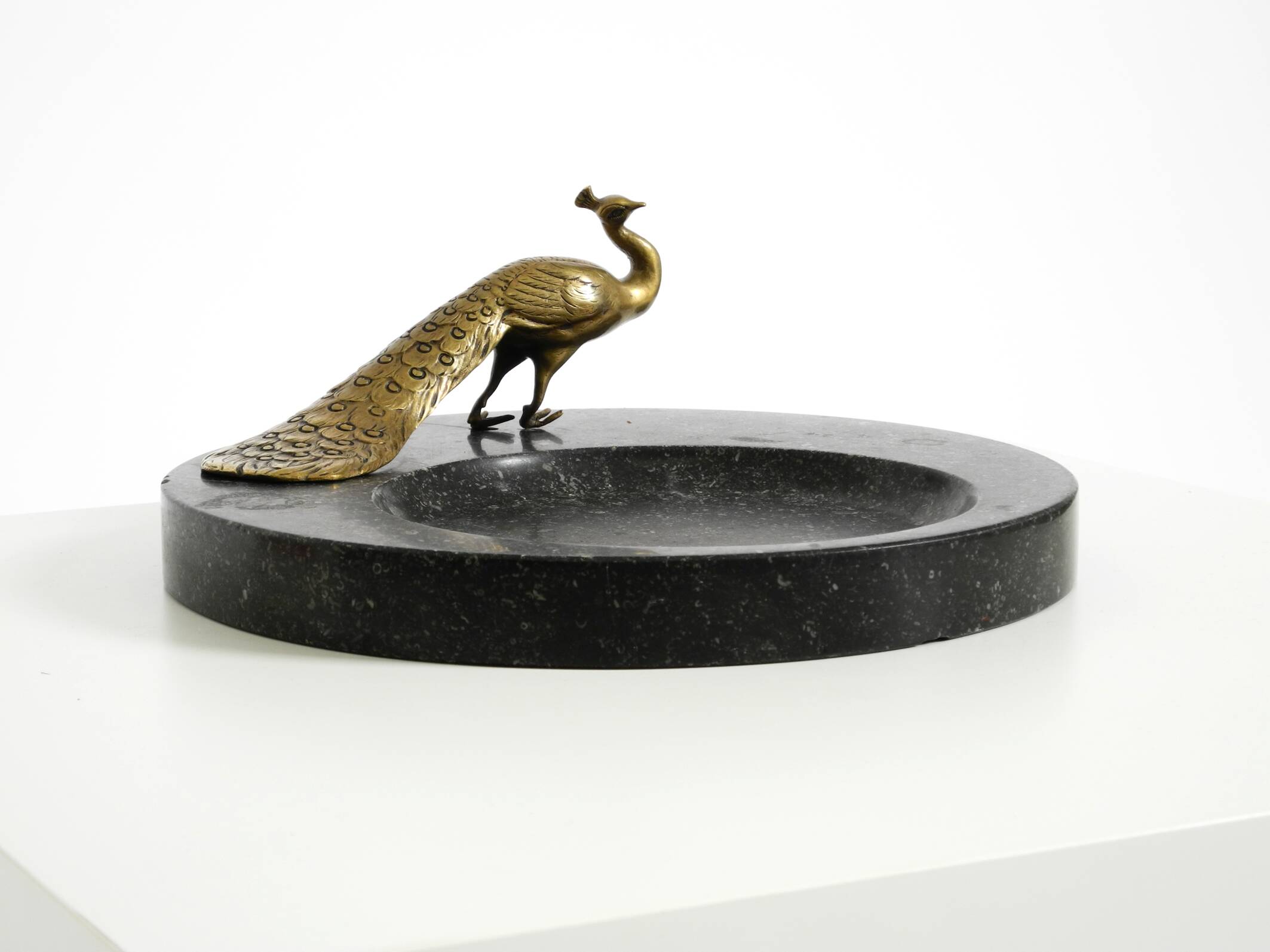 Beautiful, large black granite valet tray featuring a brass peacock, circa
