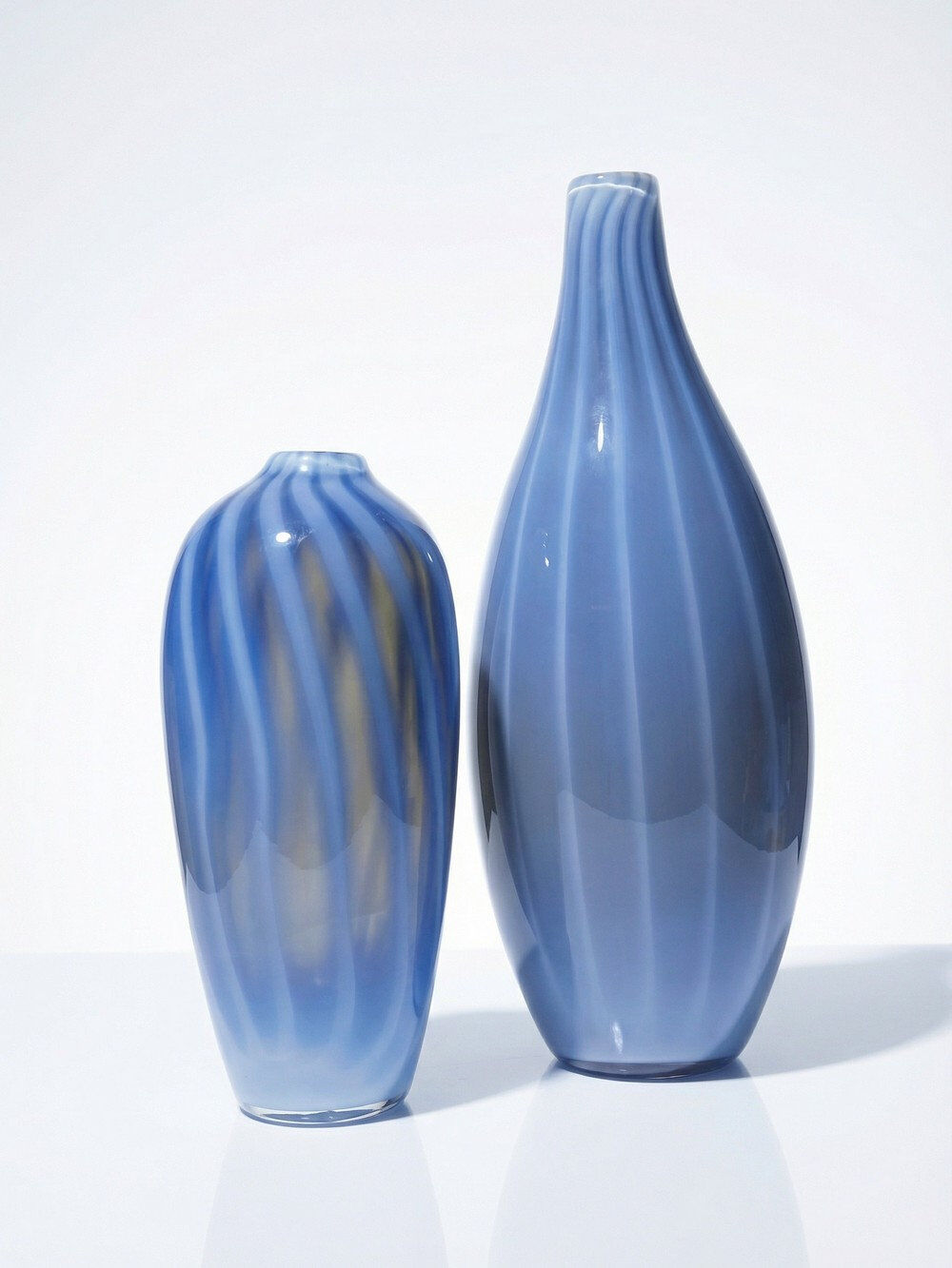 Pair of vintage smoky glass vases lined with opaline, Murano bubble glass.