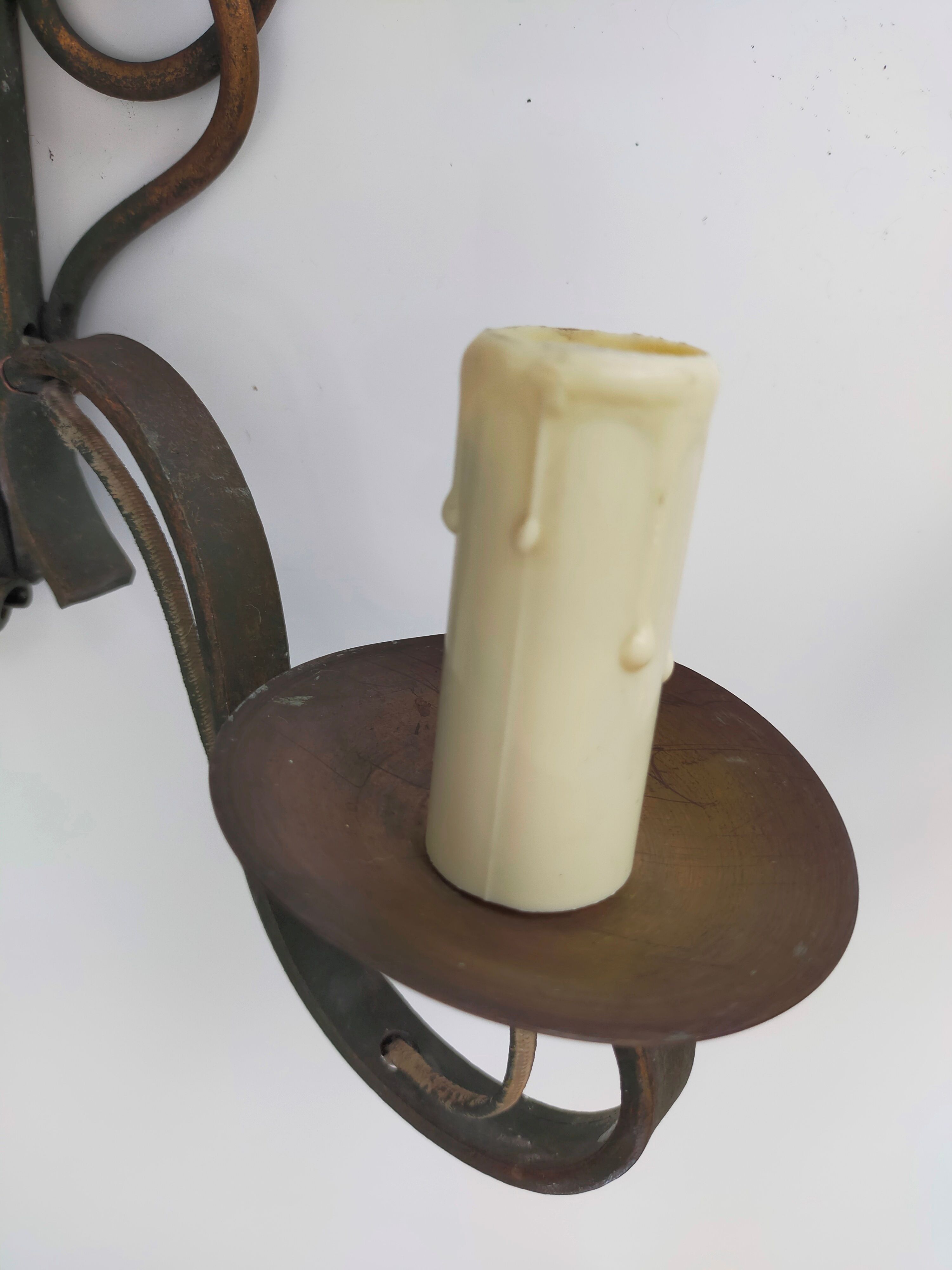 Pairs of vintage wrought iron wall lamps