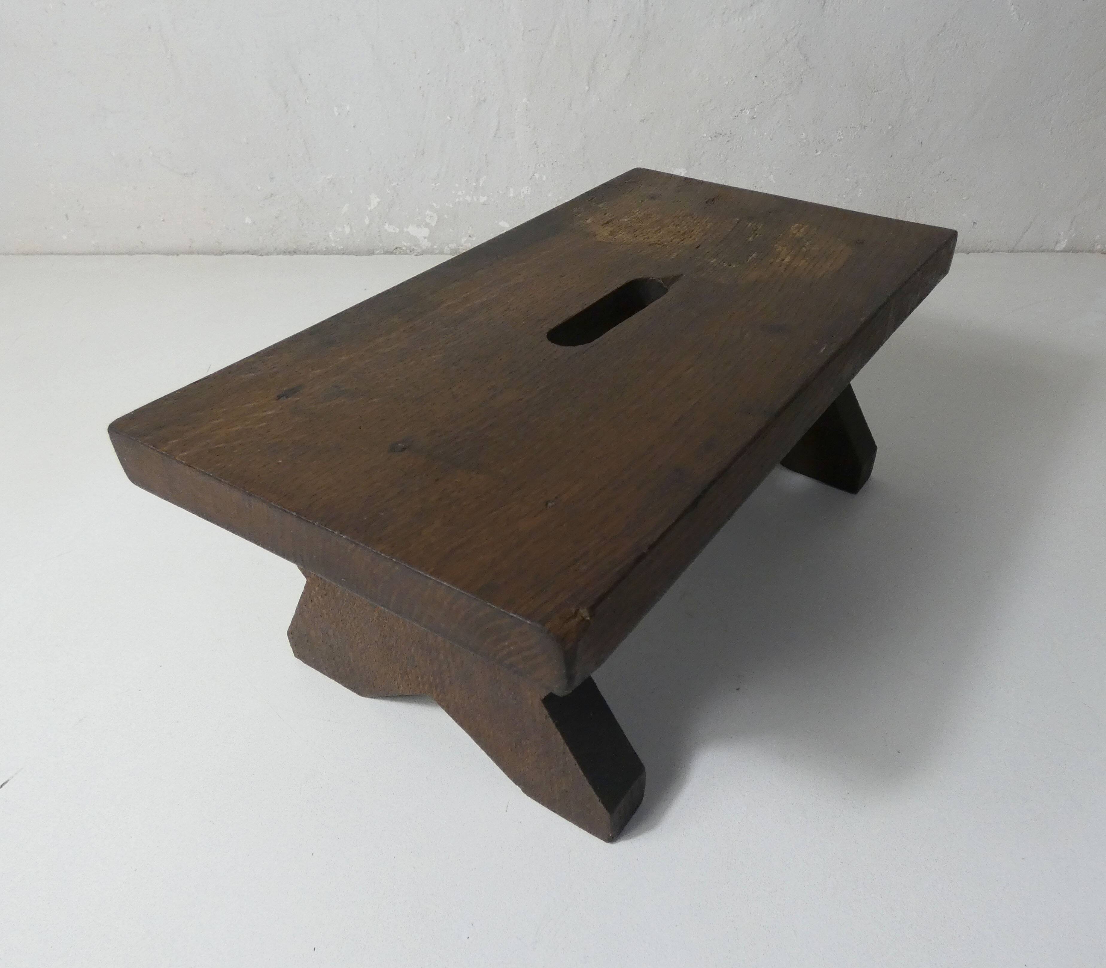 Old small wooden bench step in solid oak