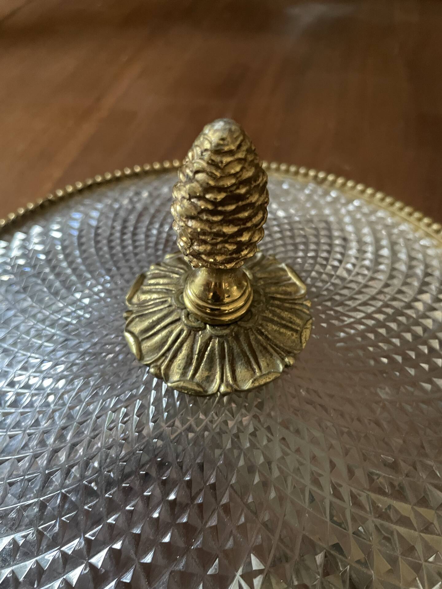Antique ceiling light in bronze and cut crystal with diamond points.