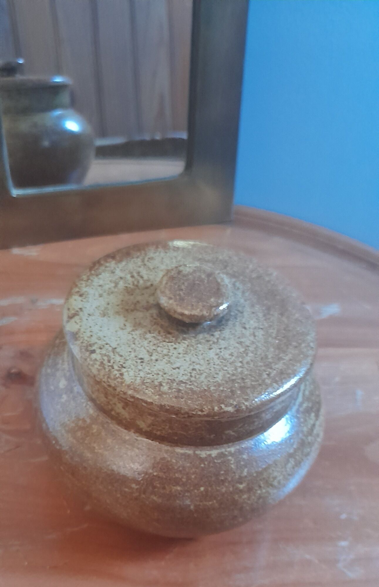 Old salt pot in sandstone, with lid